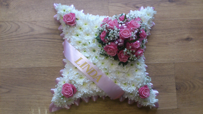 Cushion shaped funeral flowers white pink north Bristol FCU3